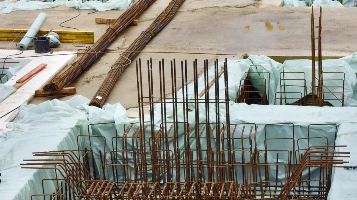 Steel reinforcement laid across a building foundation